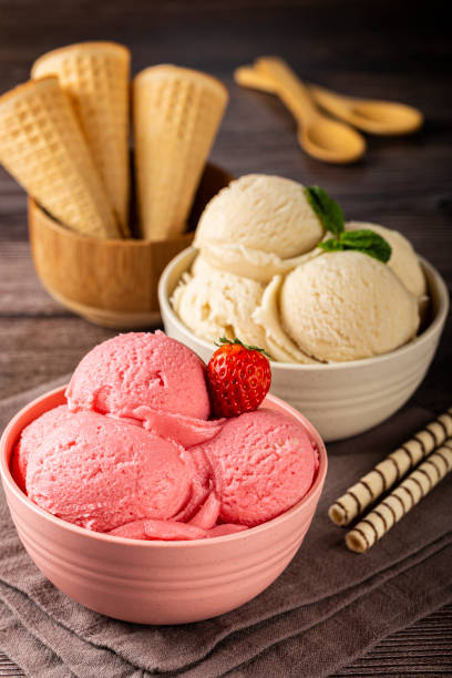 istock Bowls with strawberry and vanilla ice cream. 1326144093