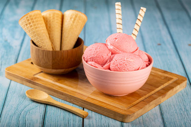 istock Bowl with strawberry ice cream balls. 1326144095