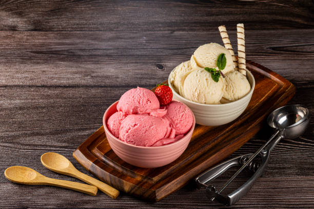 istock Bowls with strawberry and vanilla ice cream. 1326144100