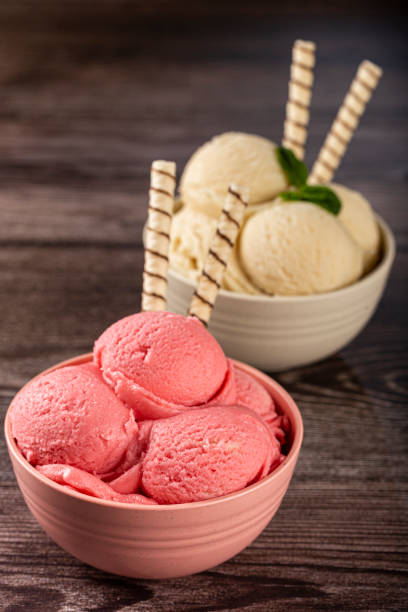 istock Bowls with strawberry and vanilla ice cream. 1326144101