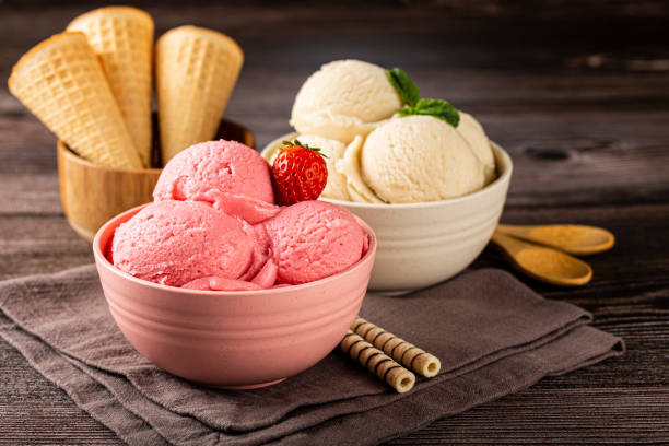 istock Bowls with strawberry and vanilla ice cream. 1326144111