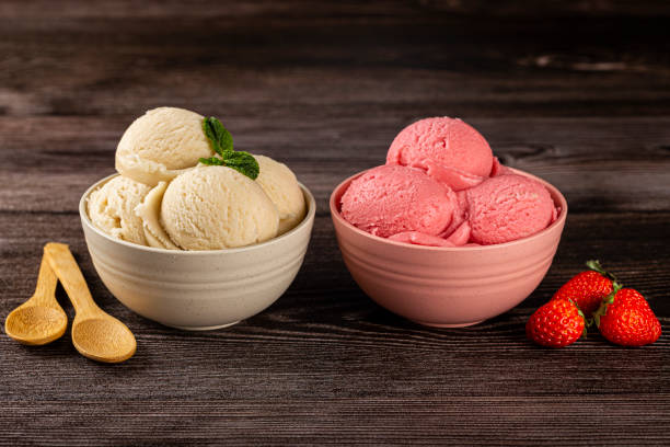 istock Bowls with strawberry and vanilla ice cream. 1326144114