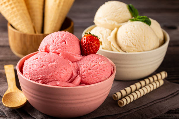 istock Bowls with strawberry and vanilla ice cream. 1326144125