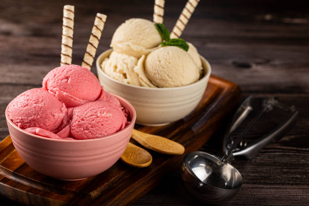 istock Bowls with strawberry and vanilla ice cream. 1326144134