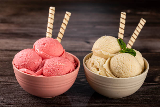 istock Bowls with strawberry and vanilla ice cream. 1326144135