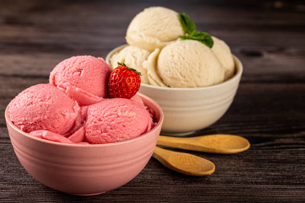 istock Bowls with strawberry and vanilla ice cream. 1326144141