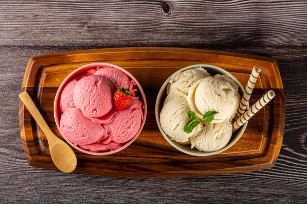 istock Bowls with strawberry and vanilla ice cream. 1326144147
