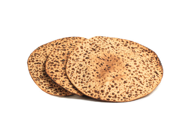 Round Passover Matzo Three Round Passover Matzo isolated on white with clipping path matzo stock pictures, royalty-free photos & images