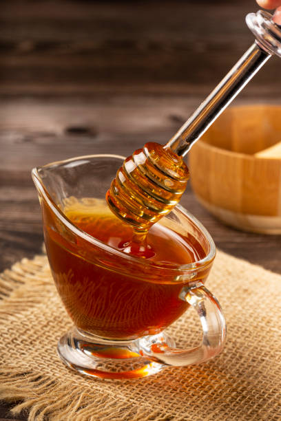 istock Honey in glass bowl on the table. 1326145290