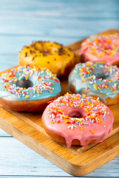 istock Delicious assorted colorful donuts on the table. 1326145735