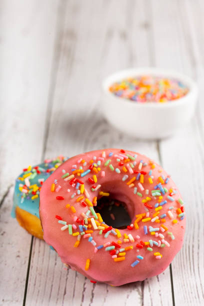istock Delicious assorted colorful donuts on the table. 1326145825
