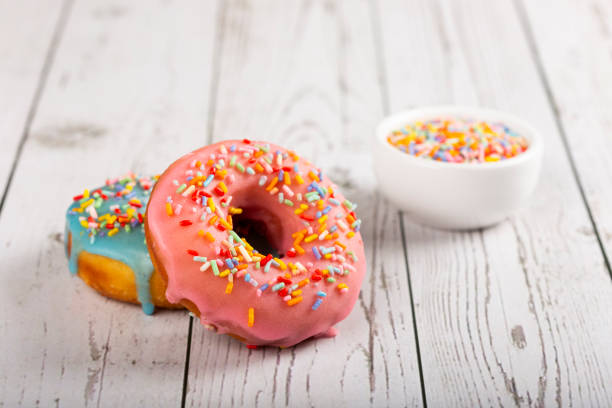istock Delicious assorted colorful donuts on the table. 1326146358