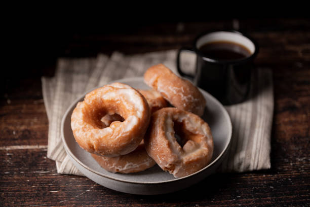 istock glazed old fashioned style doughnut on dark background 1326146788