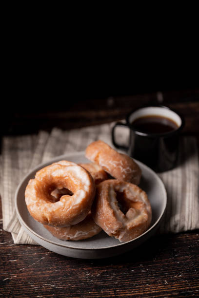istock glazed old fashioned style doughnut on dark background 1326146994