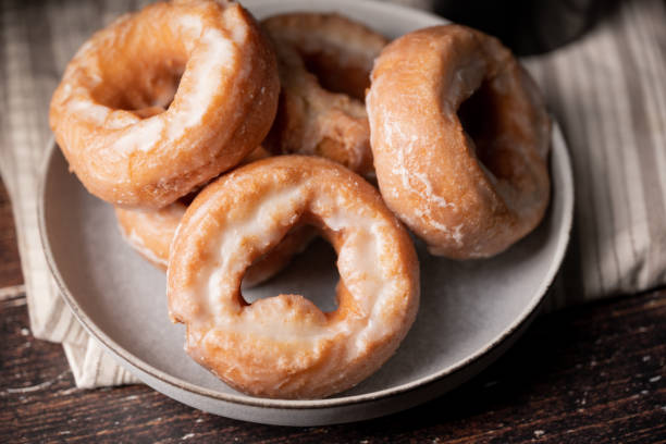 istock glazed old fashioned style doughnut on dark background 1326147166