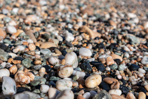 istock Aegean sea pebble marble beach close-up texture 1326148430
