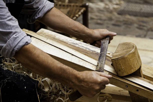 istock Artisan sanding and shaping wood 1326148852