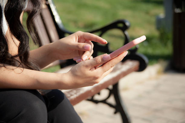 istock woman hand phone on the stairs 1326149672