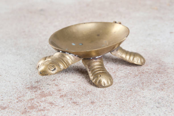 istock Old brass turtle ashtray on concrete background. 1326149826