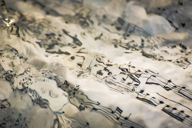 Sheet of paper with a note text by Beethoven in a mountain river stock photo