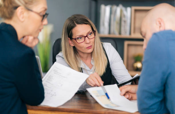 istock Couple talking with financial advisor on a meeting 1326152649