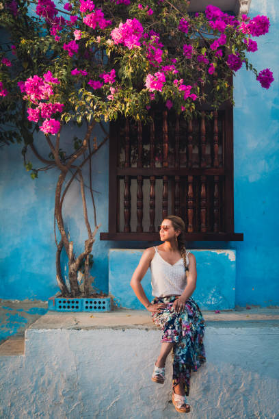 latin woman and flowers stock photo