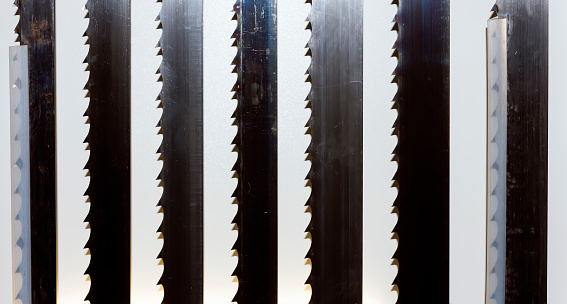 Close-up of band saw blades of various widths
