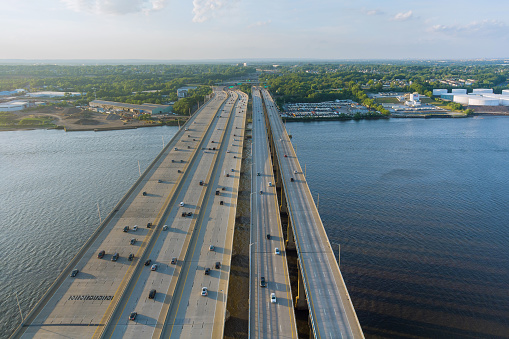 High-speed highway, with traffic road, the Alfred E. Driscoll Bridge across over the Raritan River. Aerial panoramic top view