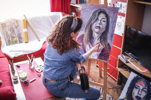 istock Creative young artist painting at home. 1326157405