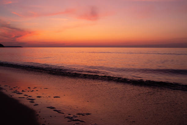 istock beautiful sunset on the sea. beach and surf at sunset. 1326157632