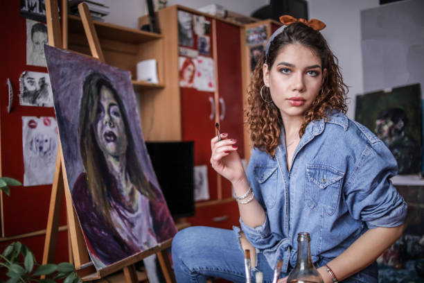 istock Creative young artist painting at home. 1326158710