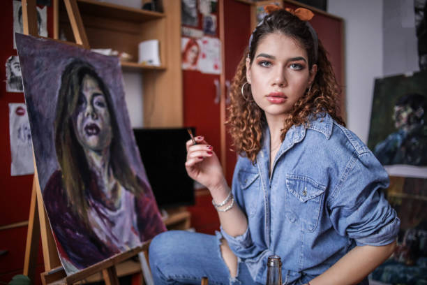 istock Creative young artist painting at home. 1326158725