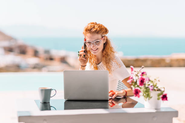 istock Business woman using laptop on terrace 1326160178