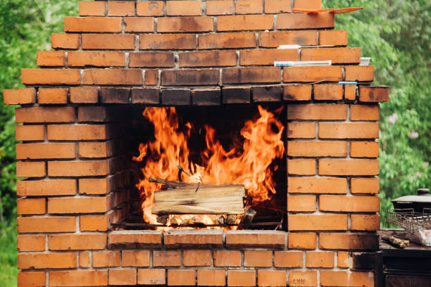 Stone garden oven for grill or barbeque is in a backyard. Selective Focus
