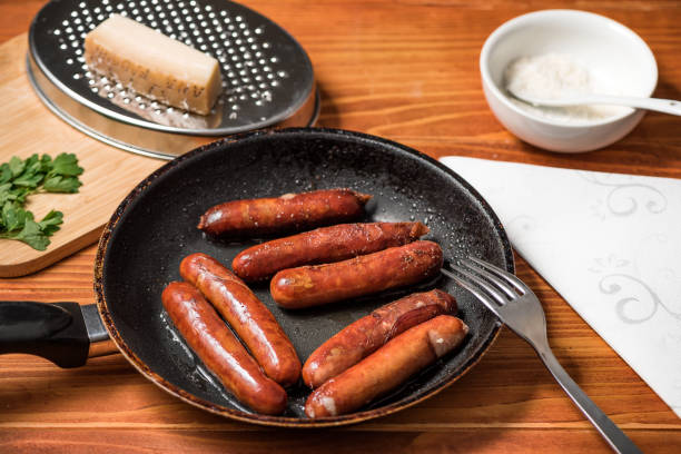 istock Sausages in frying pan 1326163310