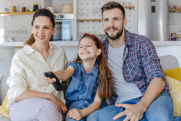 istock Family is watching TV at home 1326169156