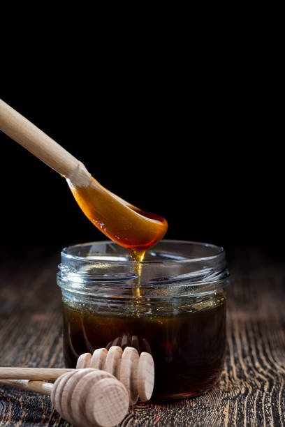 istock natural viscous honey, which is produced by honey bees 1326172669