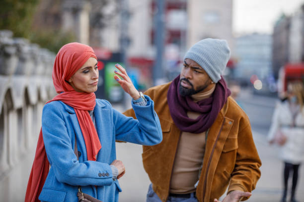istock Young Multi-Ethnic Couple is Having a Relationship Problems During a Walking Through the City Streets. 1326173405