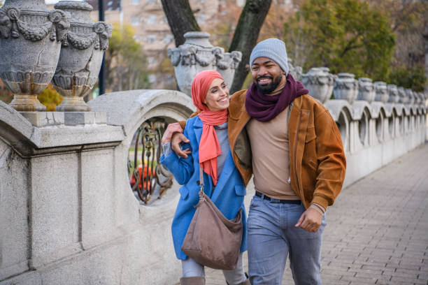 istock A Happy Multi-Ethnic Couple is Walking Through the Park. 1326173456