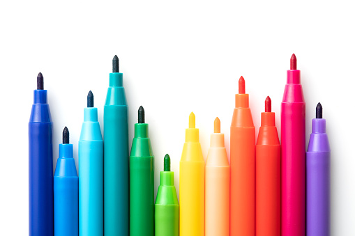 Multicolored pencils isolated on a white background. Top view