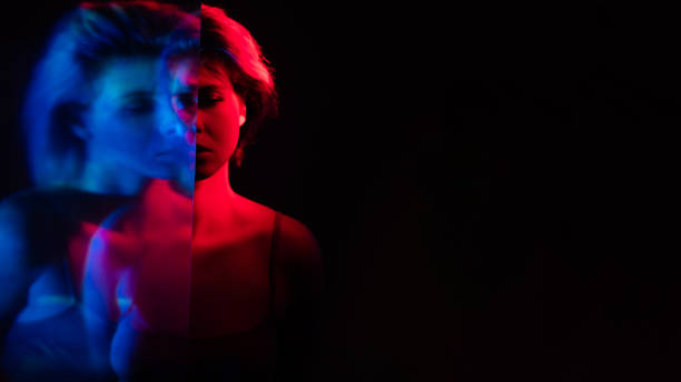 istock bipolar disorder upset woman in pink blue light 1326178930