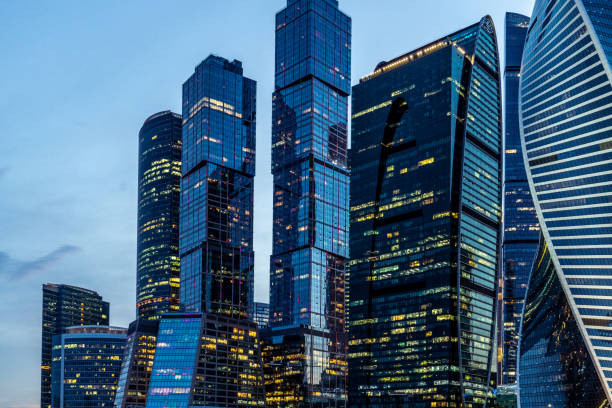The Moscow International Business Center (Moscow-City) skyscrapers against blue evening sky.