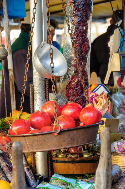 istock pomegranates inside an old metal weighing scale. 1326182291