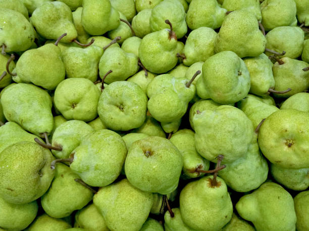 istock Stack of D'Anjou Pear. It has unique full green color. Fruit is being sold on fresh fruit market 1326182375