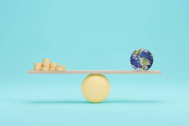istock Earth globe vs coin on scales 3D illustration. 1326185429