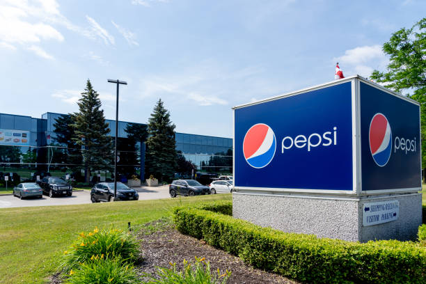 PepsiCo Canada facility on Falbourne St. in Mississauga, On, Canada. Mississauga, On, Canada - June 27, 2021: PepsiCo Canada facility on Falbourne St. in Mississauga, On, Canada. PepsiCo, Inc. is an American based multinational food, snack, and beverage corporation. cola stock pictures, royalty-free photos & images