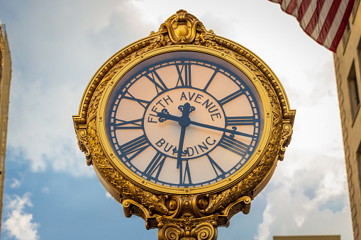 5TH Avenue clock near the Flatiron Building in New York City, NY. USA