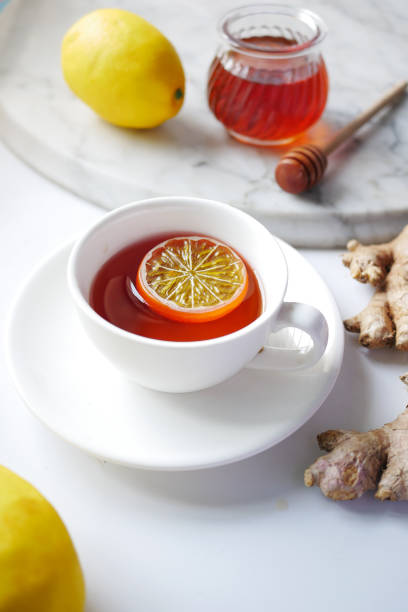 istock lemon tea with honey and ginger on table 1326190554