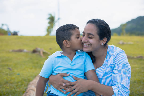son giving a kiss to his latin mom