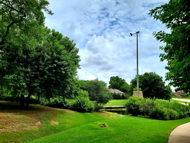 istock Stone base and and pond for windmill. 1326192180